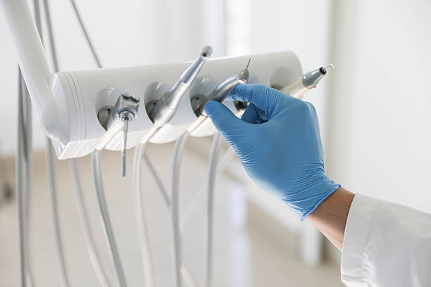 Professional Tooth Extraction technician working in Rossville, GA